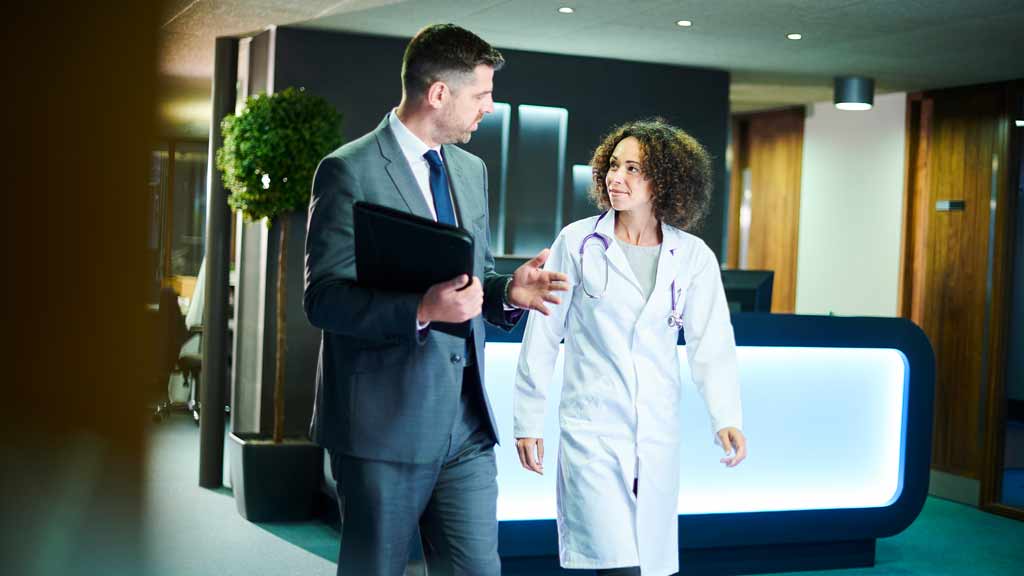 doctor speaking with administrator