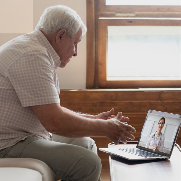 Senior man talking to a doctor virtually